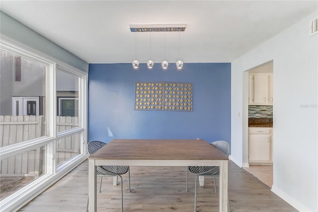 1318 Chebon Ct Unit E-F, Unit E-F, Apopka, FL 32712 - dining area featuring visible vents, light wood-style flooring, and baseboards
