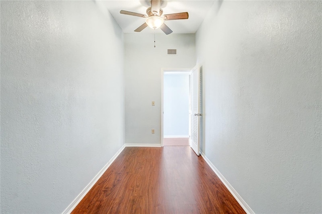 1318 Chebon Ct Unit E-F, Unit E-F, Apopka, FL 32712 - unfurnished room featuring visible vents, a textured wall, baseboards, dark wood-style flooring, and a ceiling fan