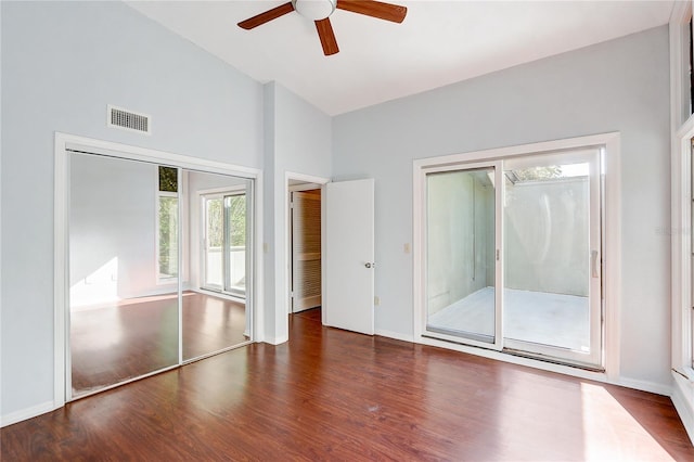 1318 Chebon Ct Unit E-F, Unit E-F, Apopka, FL 32712 - unfurnished bedroom featuring visible vents, wood finished floors, access to exterior, and high vaulted ceiling