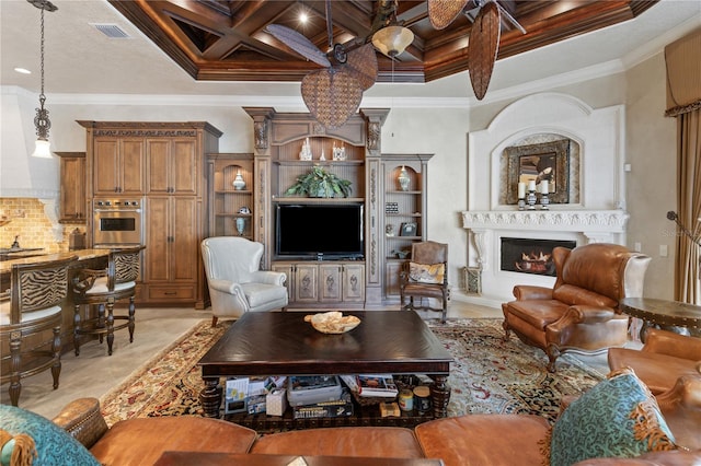 living area with beam ceiling, crown molding, coffered ceiling, and a lit fireplace