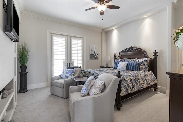 bedroom with crown molding, a ceiling fan, baseboards, and light carpet