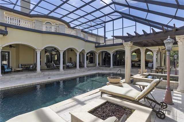 pool with a patio area, a lanai, ceiling fan, and a pergola