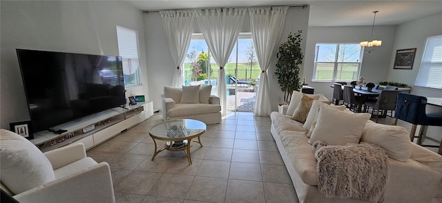 tiled living area with an inviting chandelier