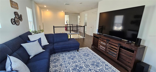 living room with visible vents and wood finished floors