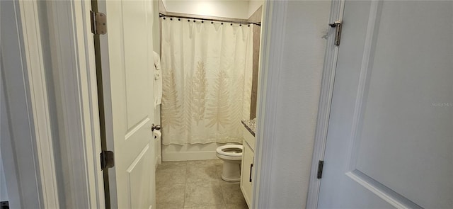 full bathroom with toilet, vanity, and tile patterned flooring