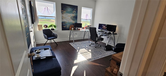 home office with a wealth of natural light, baseboards, and wood finished floors