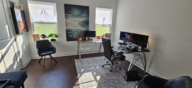 office space featuring baseboards and wood finished floors