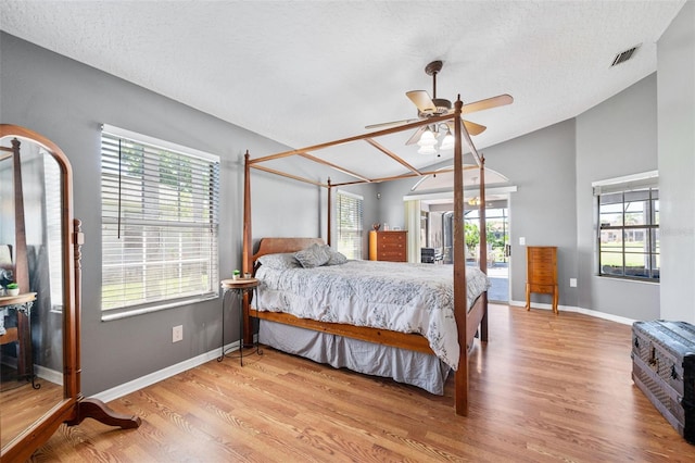 3580 Savannahs Trl, Merritt Island, FL 32953 - bedroom with visible vents, access to outside, vaulted ceiling, and wood finished floors