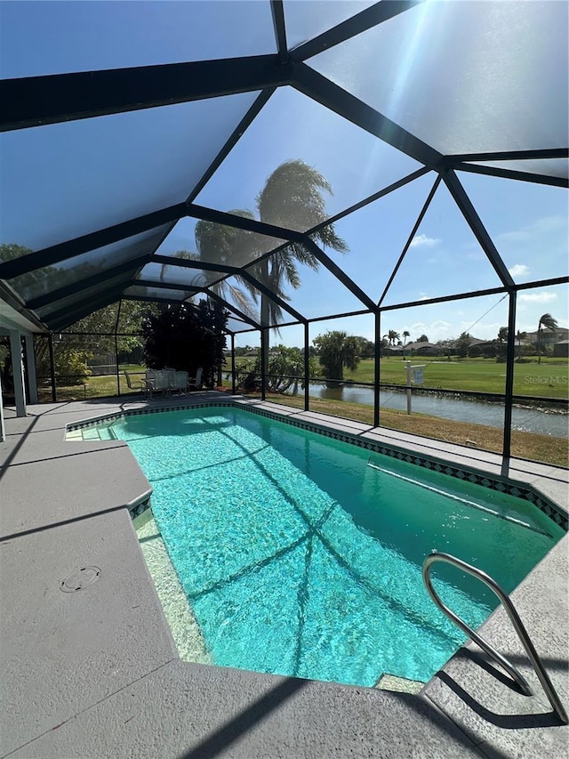 3580 Savannahs Trl, Merritt Island, FL 32953 - outdoor pool featuring a patio, glass enclosure, and a water view