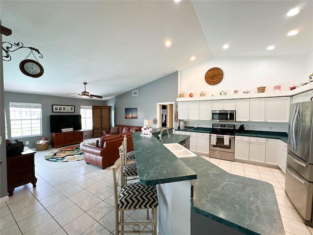 3580 Savannahs Trl, Merritt Island, FL 32953 - kitchen with a sink, white cabinets, appliances with stainless steel finishes, and light tile patterned flooring