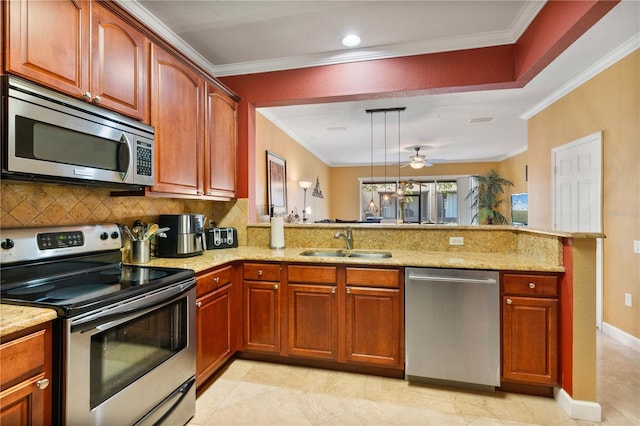 kitchen featuring appliances with stainless steel finishes, light stone countertops, crown molding, and a sink