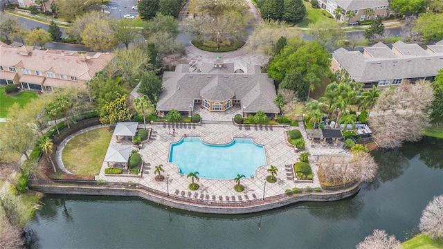 drone / aerial view featuring a residential view and a water view