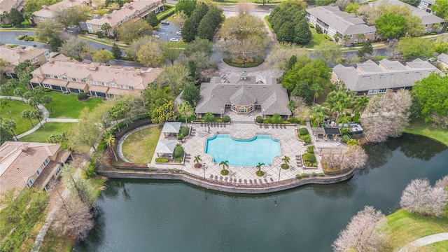 birds eye view of property featuring a residential view and a water view