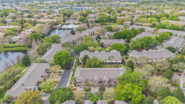 birds eye view of property featuring a residential view and a water view