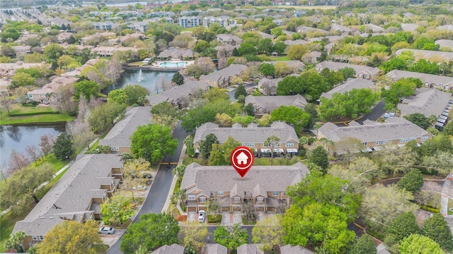 aerial view featuring a residential view and a water view