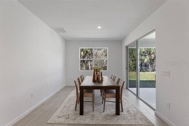 dining room with visible vents and baseboards