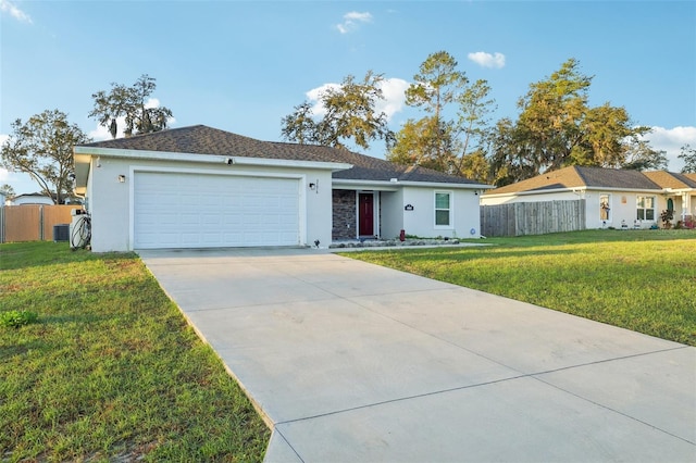 ranch-style home with stucco siding, concrete driveway, an attached garage, and fence