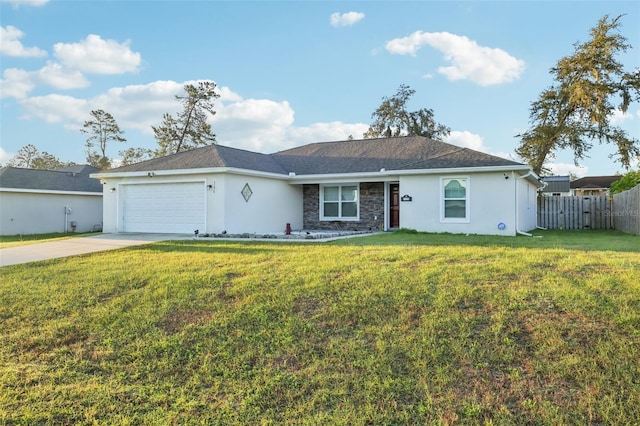 ranch-style house featuring a front yard, concrete driveway, a garage, and fence