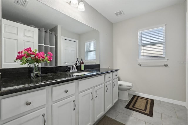 full bathroom with visible vents, baseboards, toilet, tile patterned floors, and vanity