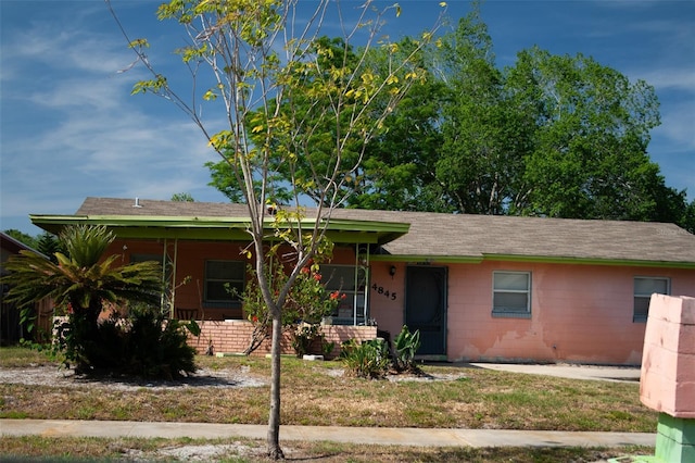 4845 Elese St, Orlando, FL 32811 - ranch-style house with concrete block siding and roof with shingles