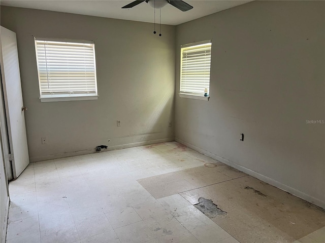 4845 Elese St, Orlando, FL 32811 - spare room with a ceiling fan and baseboards