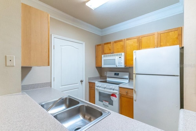 kitchen with white appliances, crown molding, light countertops, and a sink