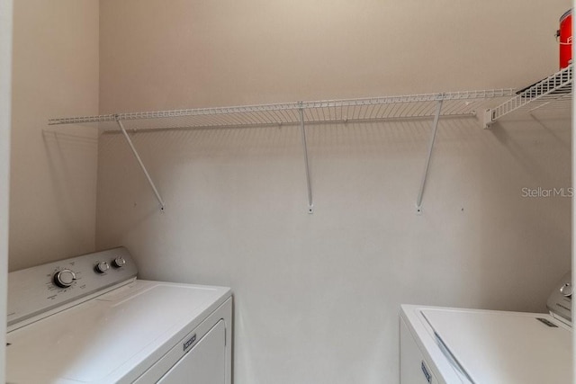 laundry room with independent washer and dryer and laundry area