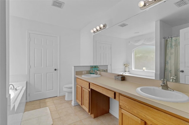 bathroom featuring a sink, visible vents, and tile patterned floors