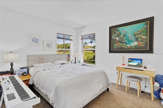 carpeted bedroom with baseboards and a textured ceiling