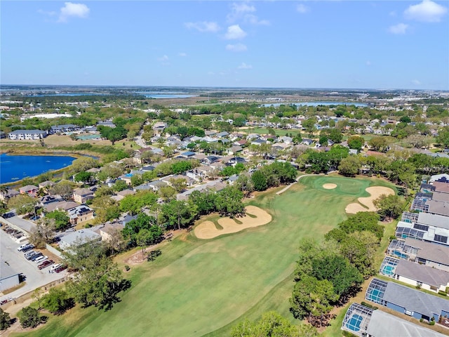 aerial view with a water view and golf course view