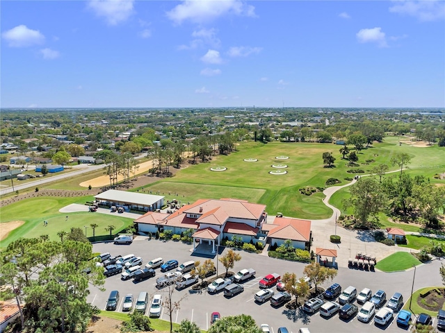 birds eye view of property with golf course view