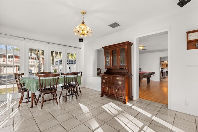 dining space with light tile patterned floors, visible vents, a healthy amount of sunlight, and billiards