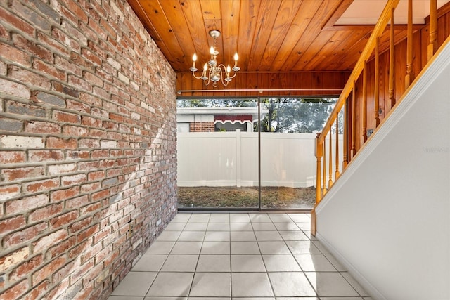 unfurnished sunroom with wooden ceiling and an inviting chandelier