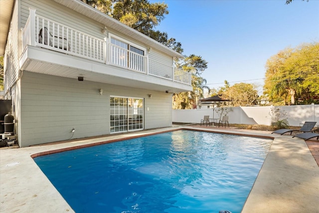 view of pool with a fenced in pool, a fenced backyard, and a patio area