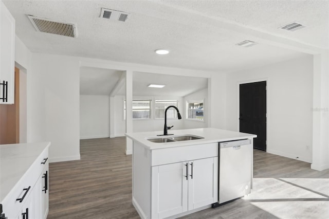 kitchen featuring dishwasher, visible vents, and a sink