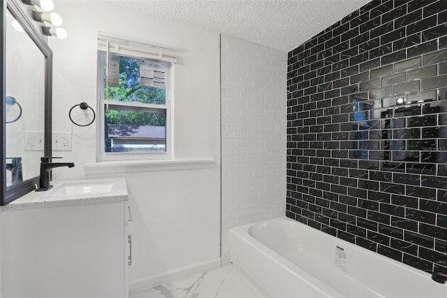 full bath featuring baseboards, vanity, bathing tub / shower combination, marble finish floor, and a textured ceiling