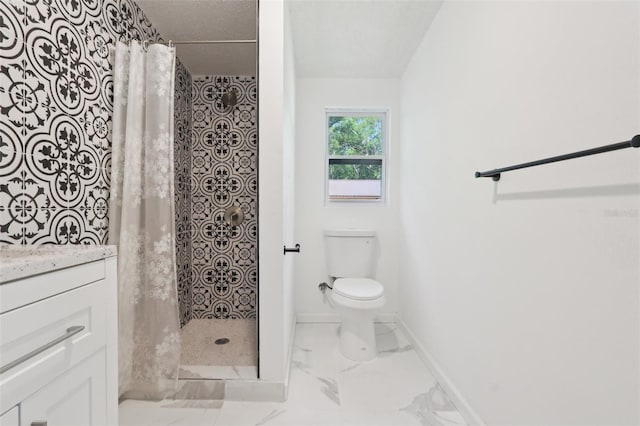 bathroom with vanity, baseboards, a shower stall, toilet, and marble finish floor