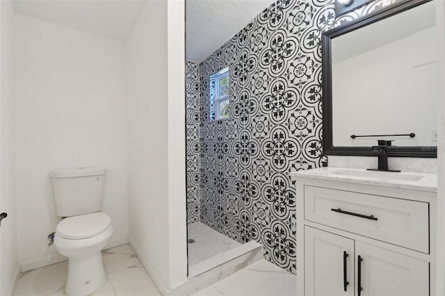 bathroom with vanity, baseboards, a stall shower, toilet, and marble finish floor