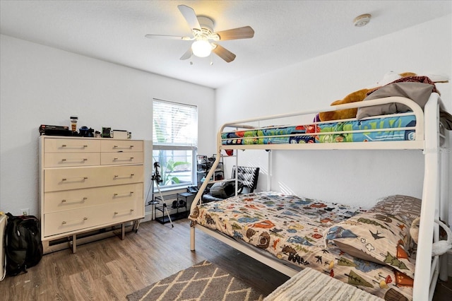 bedroom with wood finished floors and ceiling fan