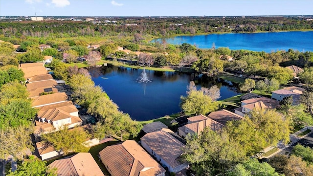 drone / aerial view featuring a residential view and a water view