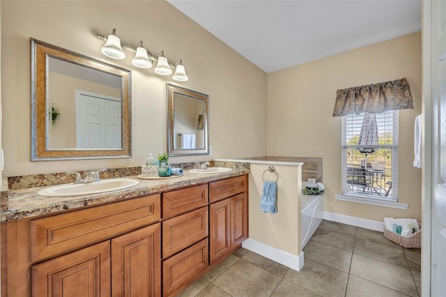 full bathroom with tile patterned flooring, double vanity, a garden tub, and a sink