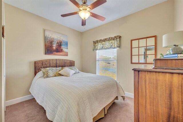 carpeted bedroom featuring baseboards