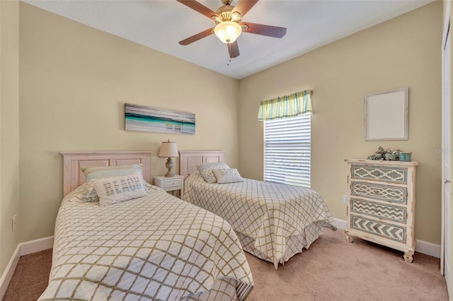 bedroom featuring baseboards, carpet floors, and ceiling fan