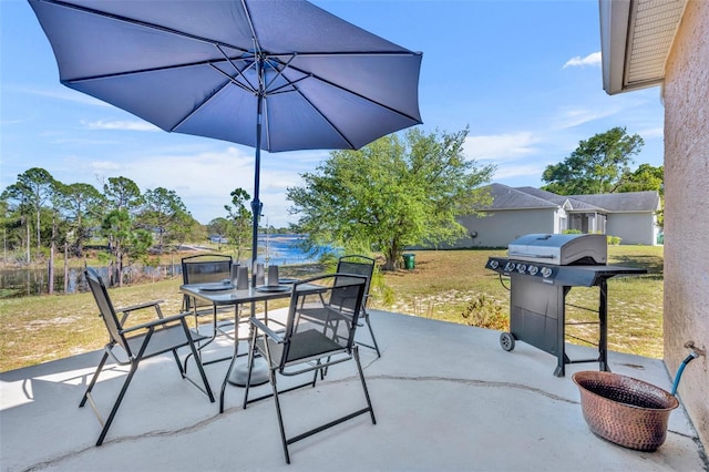 view of patio featuring outdoor dining area and grilling area