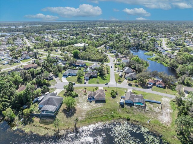 birds eye view of property featuring a residential view and a water view
