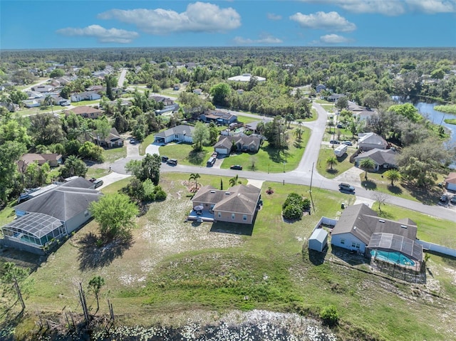 bird's eye view with a residential view and a view of trees