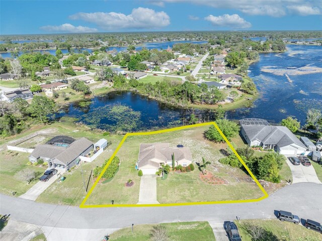birds eye view of property featuring a residential view and a water view