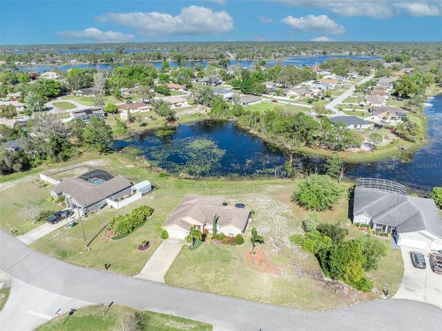 bird's eye view with a residential view and a water view