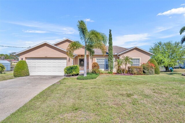 ranch-style home featuring stucco siding, driveway, a front yard, and an attached garage