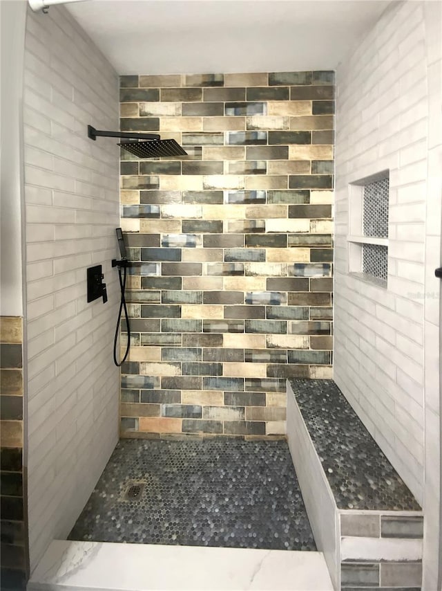 bathroom featuring tiled shower